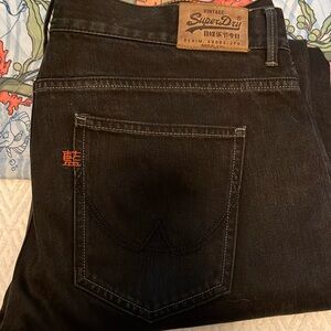 Black jeans 36x34. Button fly. Loose.